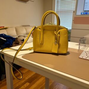 Small yellow Kate Spade convertible bag